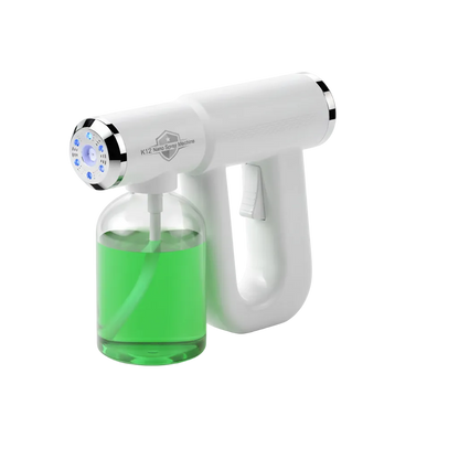 A handheld electric liquid dispenser with a white body, silver trim, and a clear bottle filled with bright green liquid, shown on a clean white background.