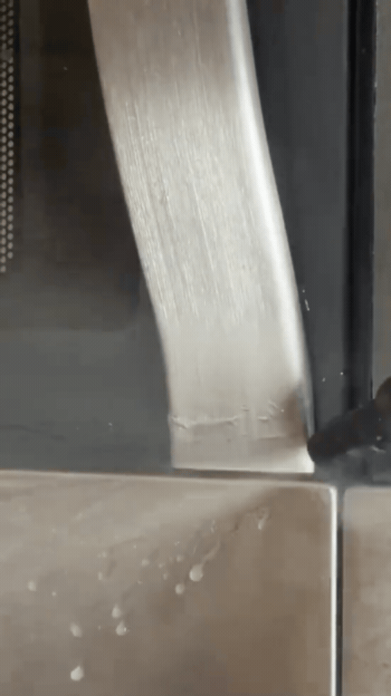 Steam cleaning a stovetop